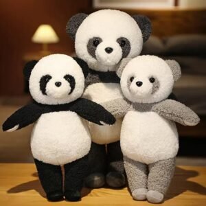 “Three standing kawaii panda plush toys in black, light grey, dark grey”