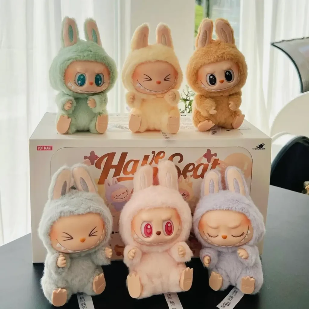 Six Labubu Bunny vinyl toys from Pop Mart blind box series displayed on product box in soft lighting