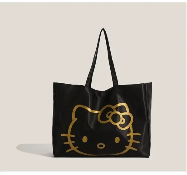 Hello Kitty silver tote bag with plush keychain charm