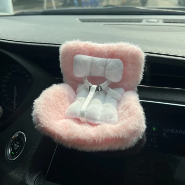 Plush pink car safety seat for dolls and toys with soft cushion and Velcro straps, perfect for Labubu and other figures.