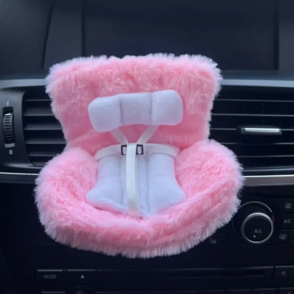 Plush pink car safety seat for dolls and toys with soft cushion and Velcro straps, perfect for Labubu and other figures.