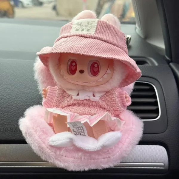 Plush pink car safety seat for dolls and toys with soft cushion and Velcro straps, perfect for Labubu and other figures.